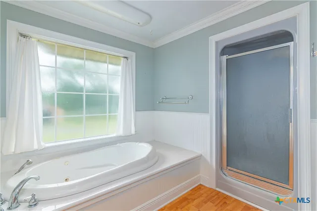 a view of an entryway with wooden floor