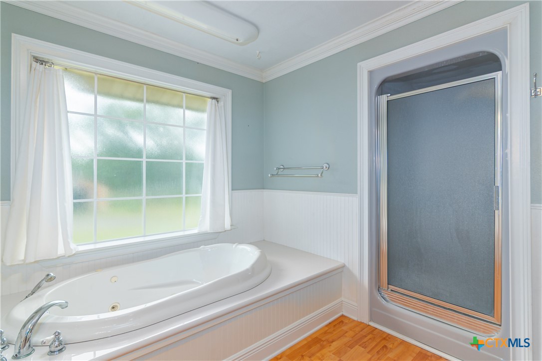 2981 Vivroux Ranch Road Seguin, TX 78155 - Photo 25 of 43 a bathroom with a tub and shower