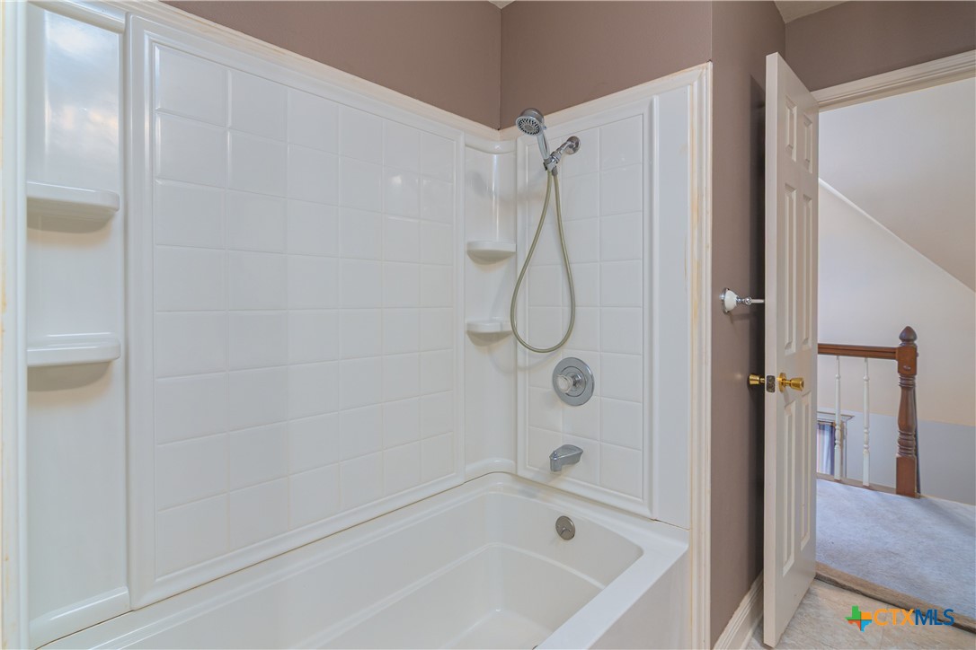 2981 Vivroux Ranch Road Seguin, TX 78155 - Photo 31 of 43 a bathroom with a bath tub with a shower
