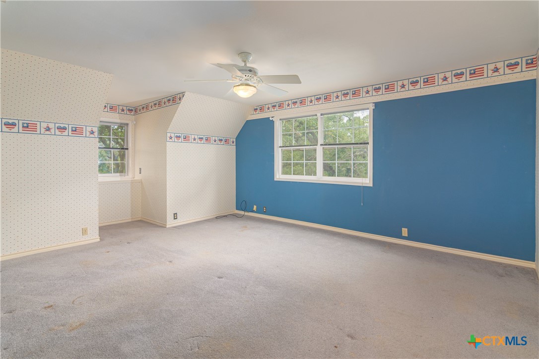 2981 Vivroux Ranch Road Seguin, TX 78155 - Photo 34 of 43 an empty room with windows and closet