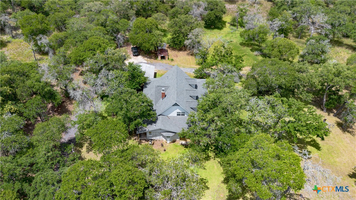 2981 Vivroux Ranch Road Seguin, TX 78155 - Photo 40 of 43 an aerial view of residential house with outdoor space and trees all around