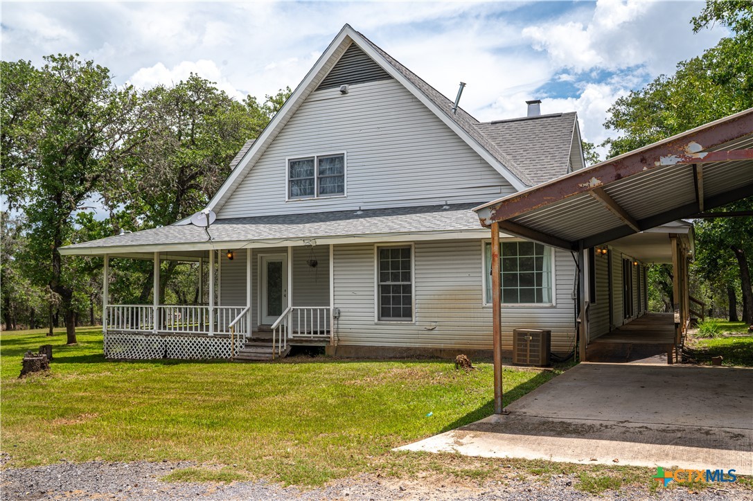2981 Vivroux Ranch Road Seguin, TX 78155 - Photo 43 of 43 a front view of a house with garden