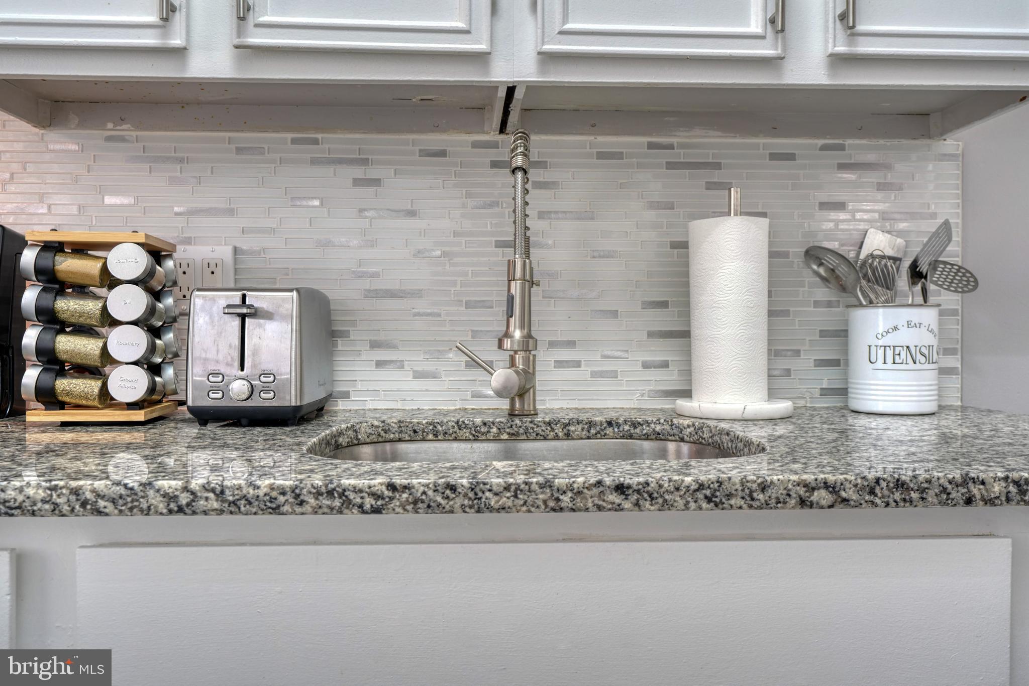 2124 Redthorn Road Baltimore, MD 21220 - Photo 12 of 39 a bathroom with a granite countertop sink