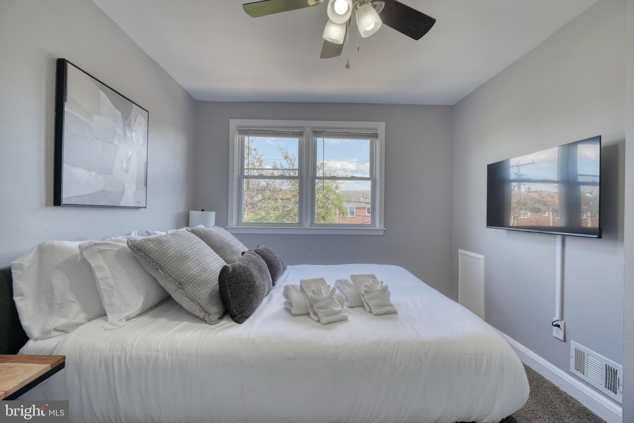 2124 Redthorn Road Baltimore, MD 21220 - Photo 16 of 39 a bedroom with a bed and a flat screen tv