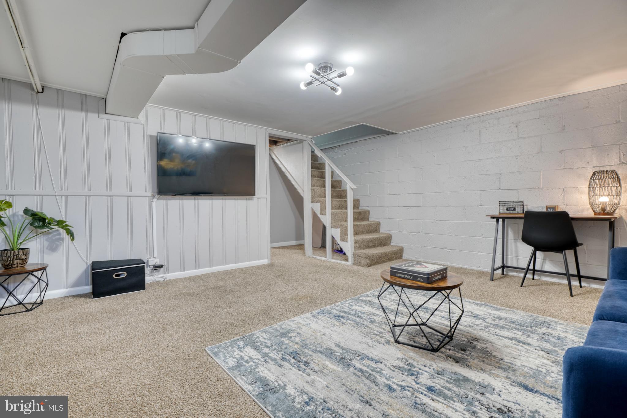 2124 Redthorn Road Baltimore, MD 21220 - Photo 20 of 39 a living room with furniture and a flat screen tv
