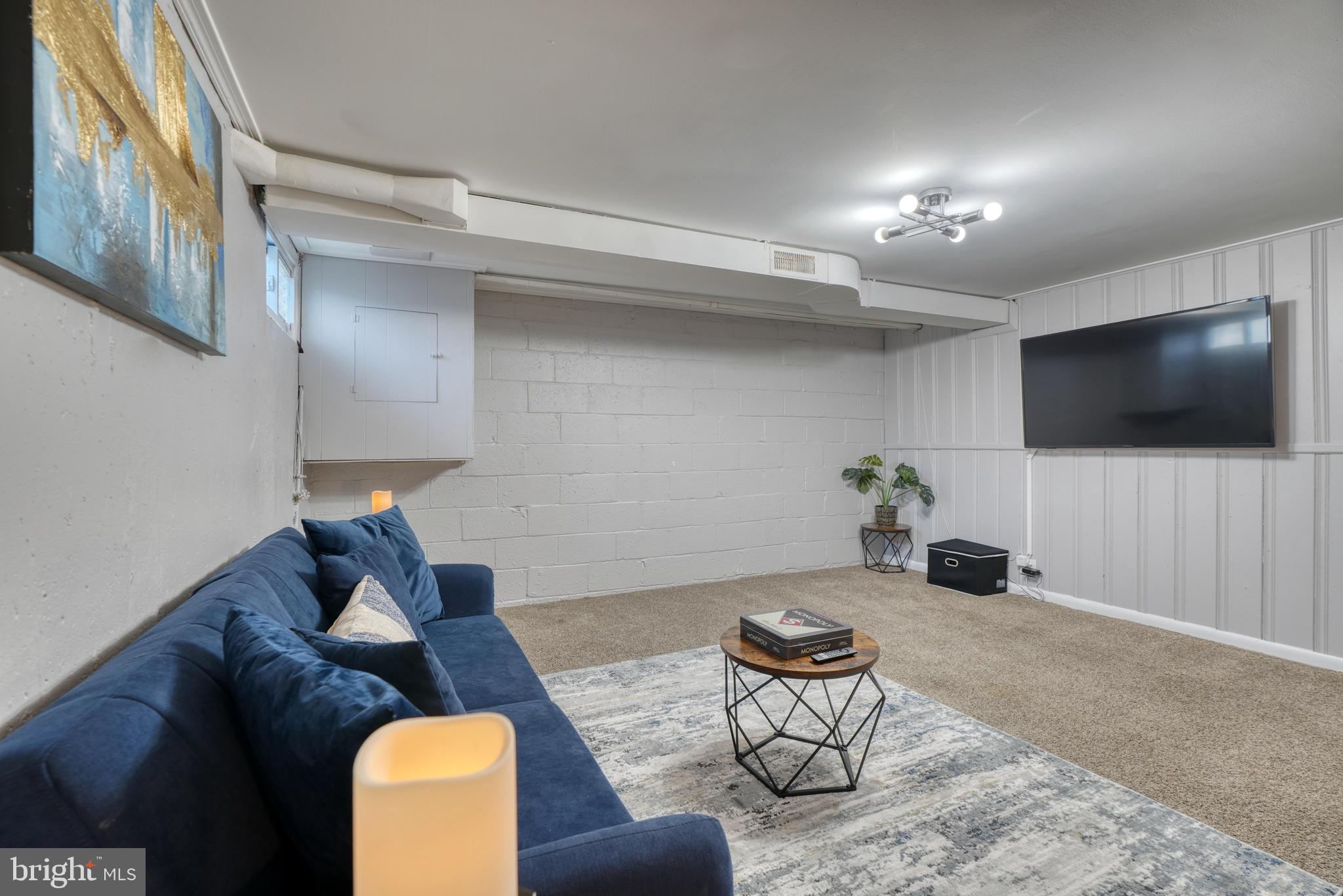 2124 Redthorn Road Baltimore, MD 21220 - Photo 21 of 39 a living room with furniture and a flat screen tv