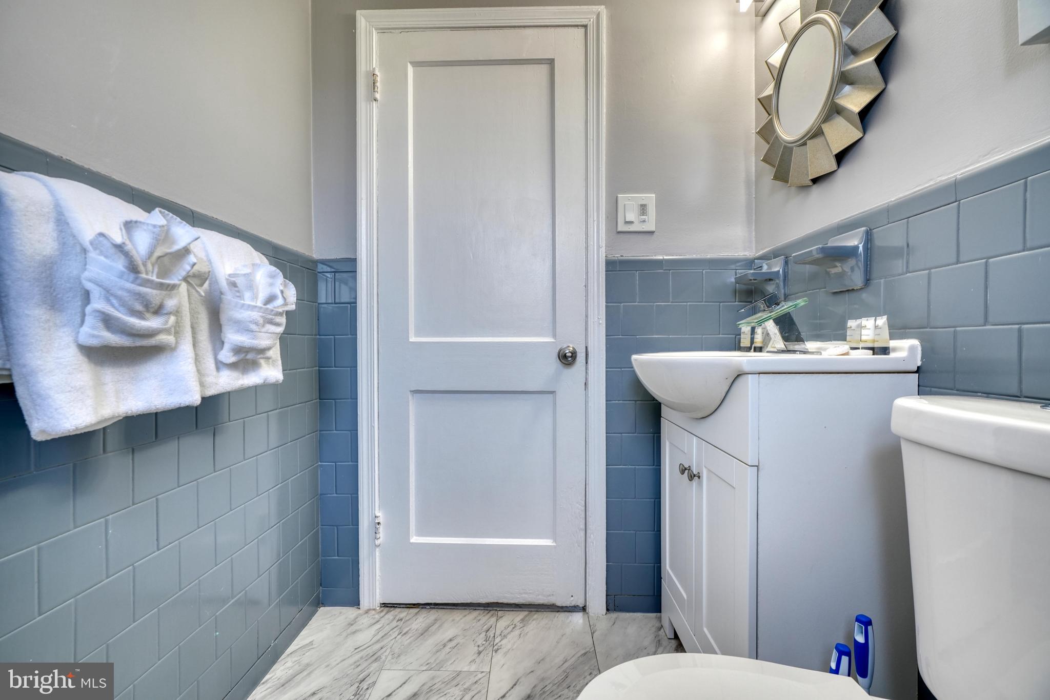 2124 Redthorn Road Baltimore, MD 21220 - Photo 25 of 39 a bathroom with a sink toilet and shower