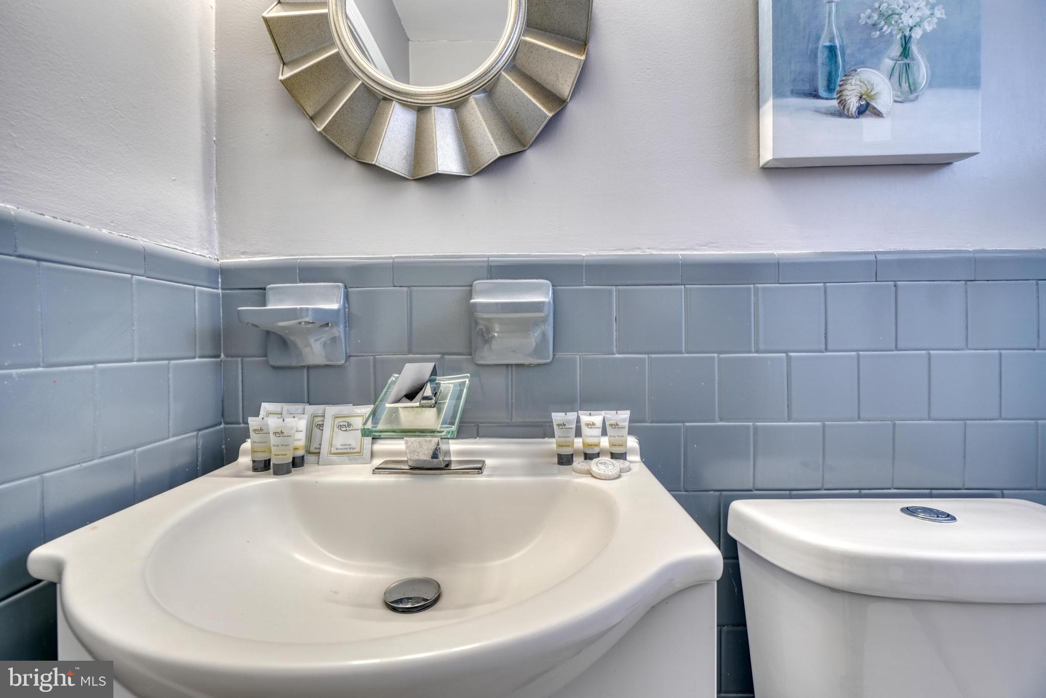 2124 Redthorn Road Baltimore, MD 21220 - Photo 28 of 39 a bathroom with a sink and a toilet