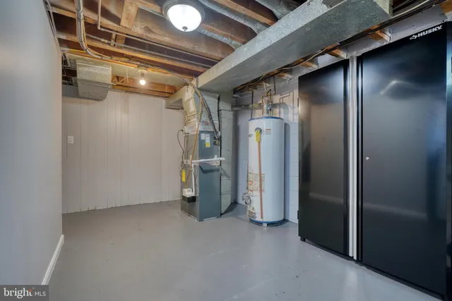 a view of empty room with wooden walls