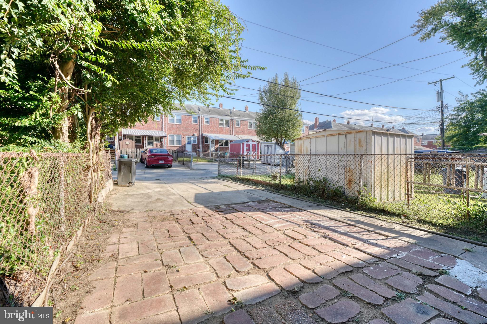 2124 Redthorn Road Baltimore, MD 21220 - Photo 35 of 39 a view of a street with a car parked in front of it