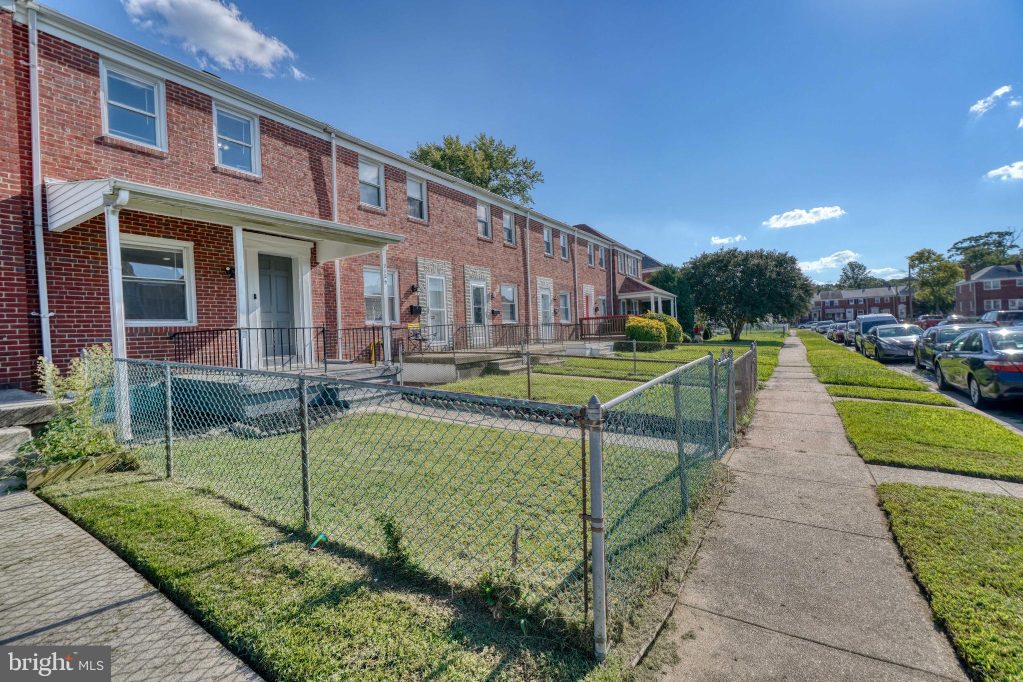 2124 Redthorn Road Baltimore, MD 21220 - Photo 38 of 39 a view of a brick building next to a yard