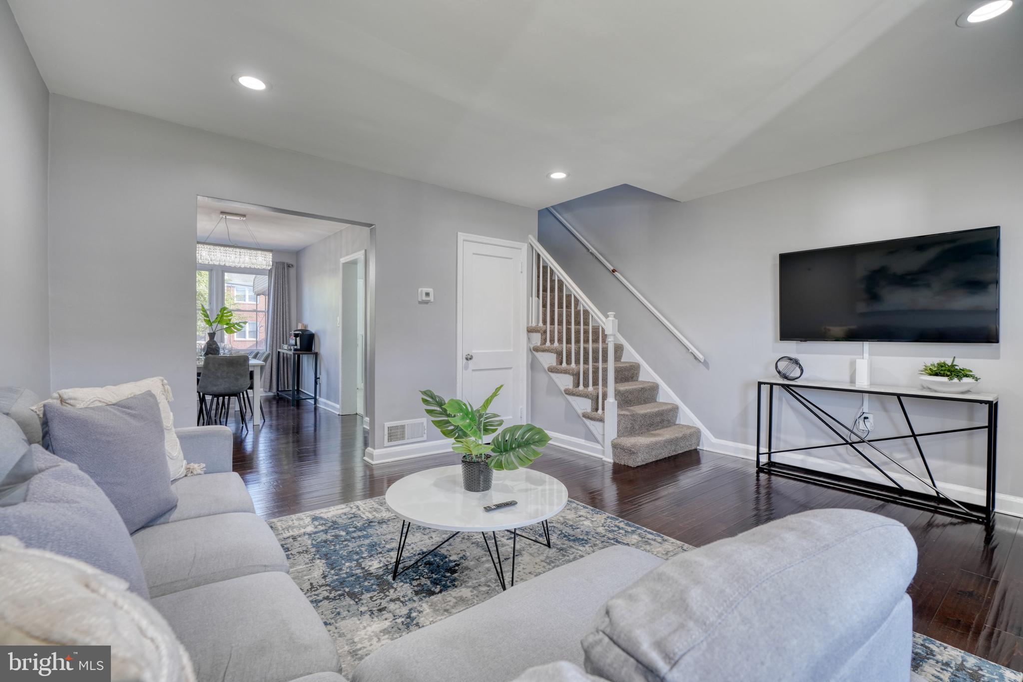 2124 Redthorn Road Baltimore, MD 21220 - Photo 5 of 39 a living room with furniture and a flat screen tv