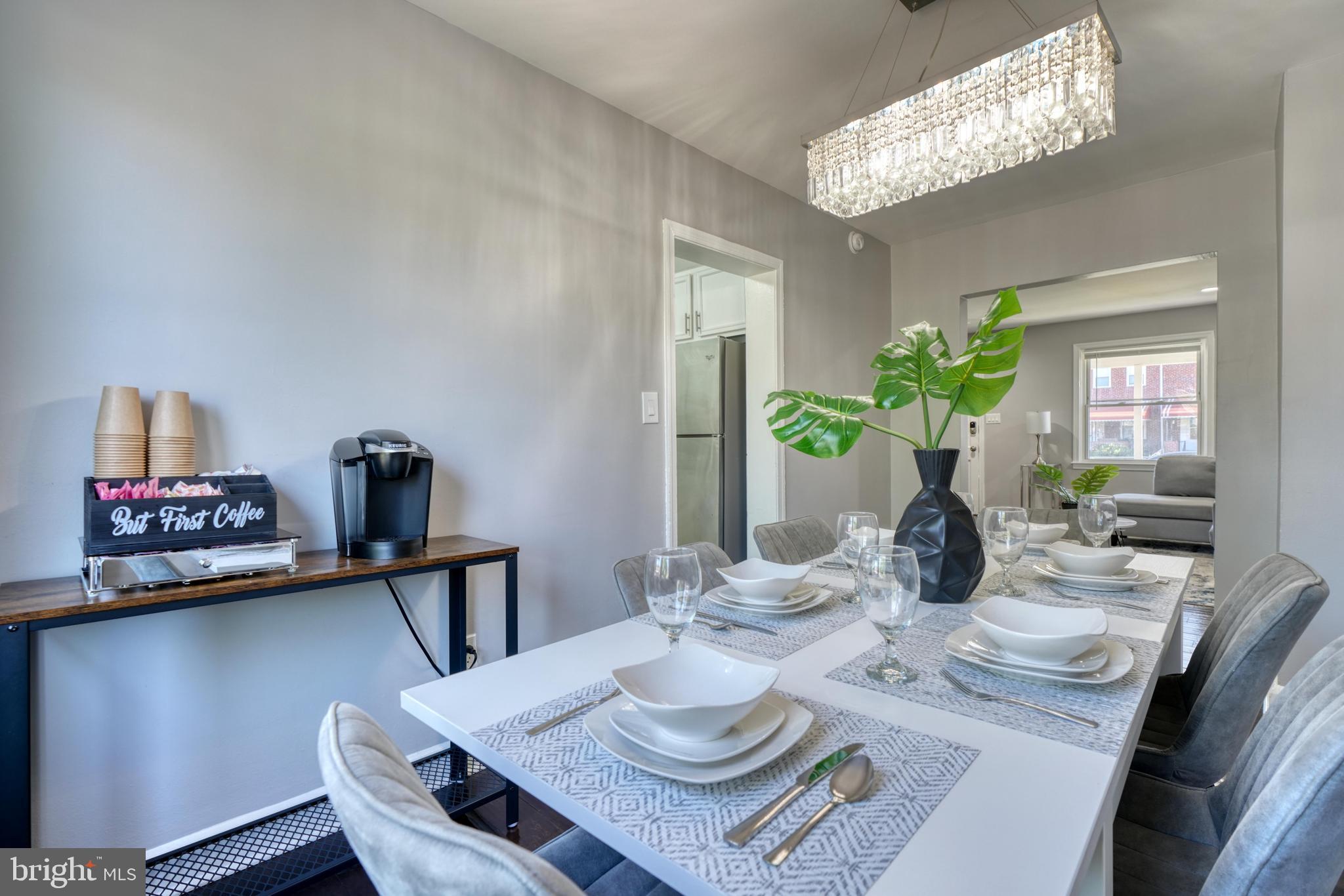 2124 Redthorn Road Baltimore, MD 21220 - Photo 7 of 39 a view of a dining room with furniture and a chandelier