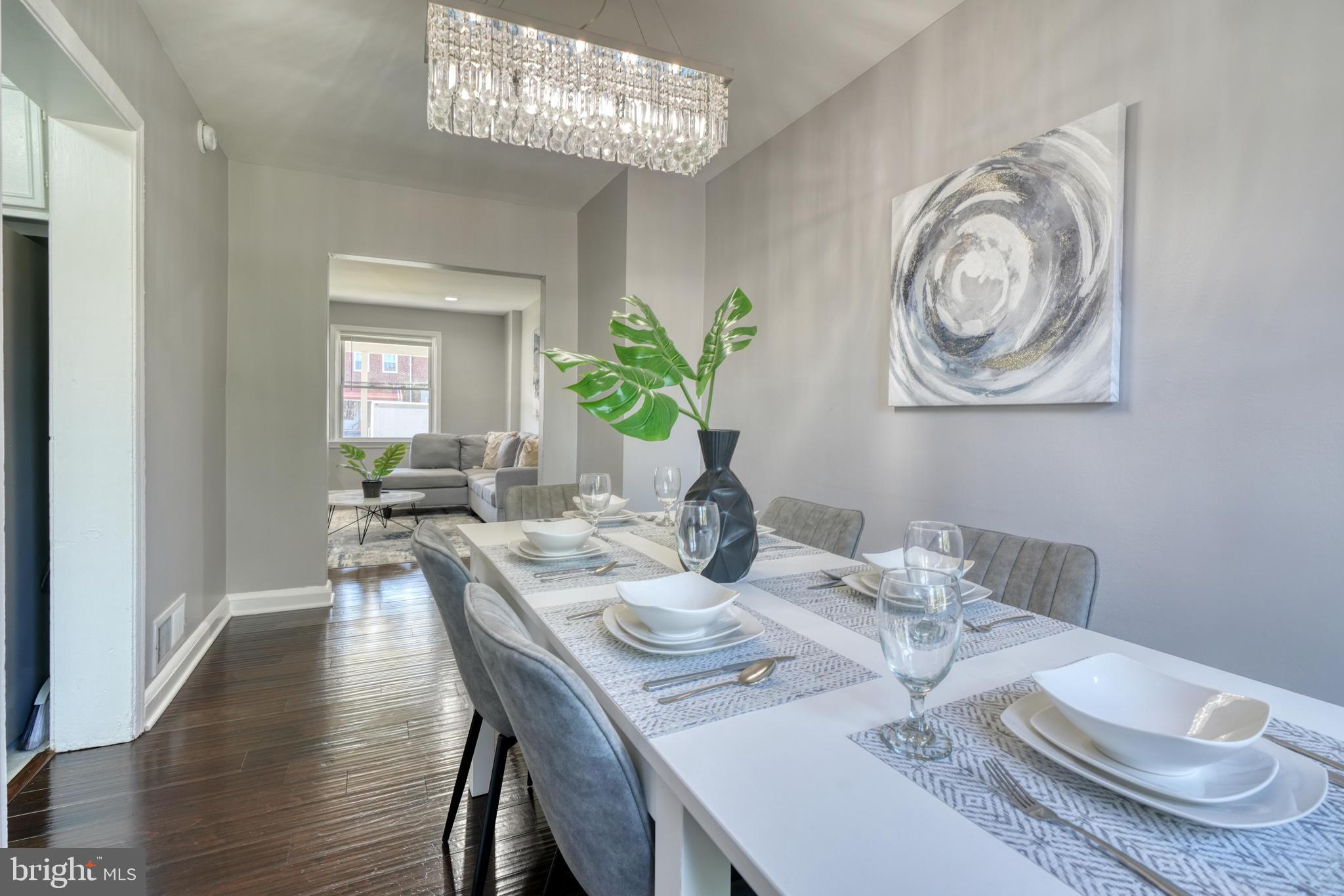 2124 Redthorn Road Baltimore, MD 21220 - Photo 8 of 39 a view of a dining room with furniture wooden floor and a chandelier