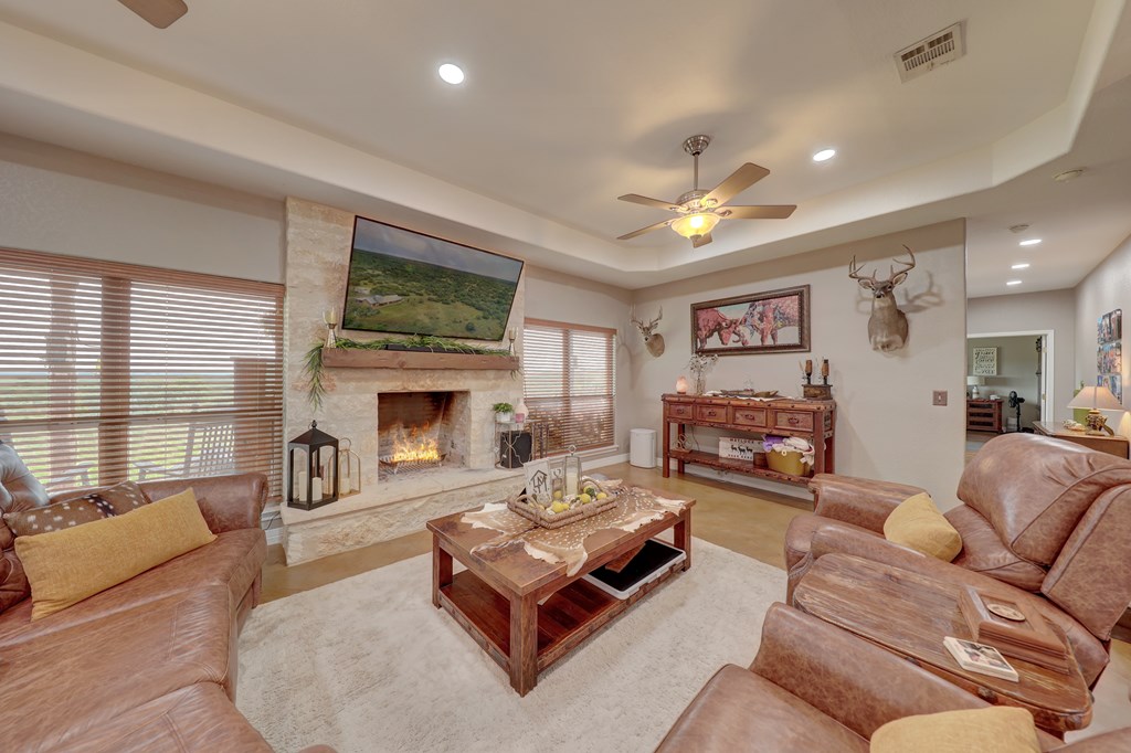 8177 Wendel Road Harper, TX 78631 - Photo 7 of 32 a living room with furniture fireplace and window