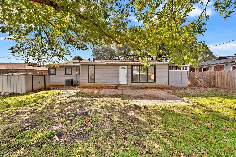 6833 Norma Street Fort Worth, TX 76112 - Photo 15 of 17 front view of a house with a yard