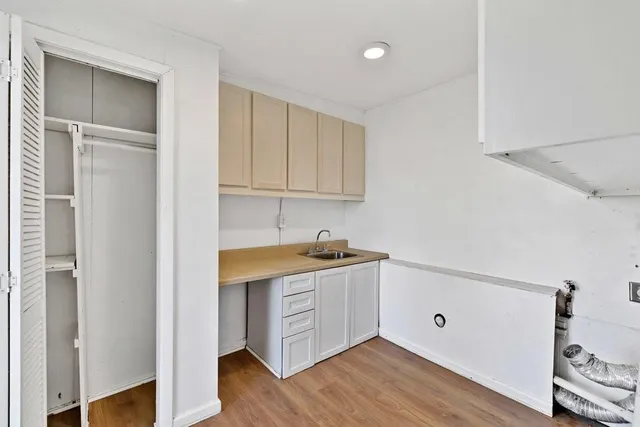 a bathroom with a toilet a sink and bathtub