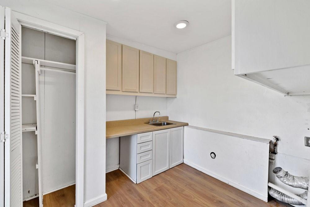 6833 Norma Street Fort Worth, TX 76112 - Photo 8 of 17 a kitchen with granite countertop a sink and cabinets