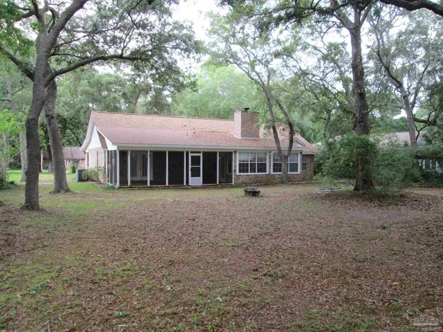 a backyard of a house with lots of green space