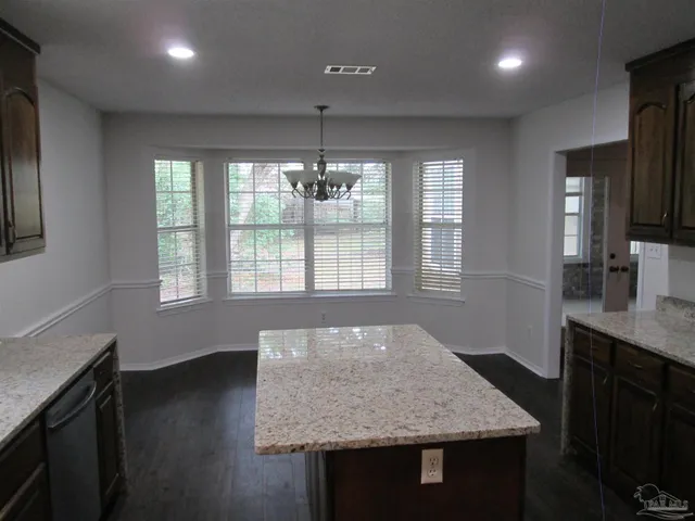 a view of a room with wooden floor and balcony