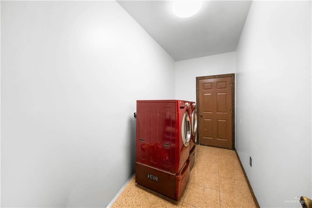 6813 North Gwin Road Edinburg, TX 78542 - Photo 11 of 20 a view of an empty room with wooden floor