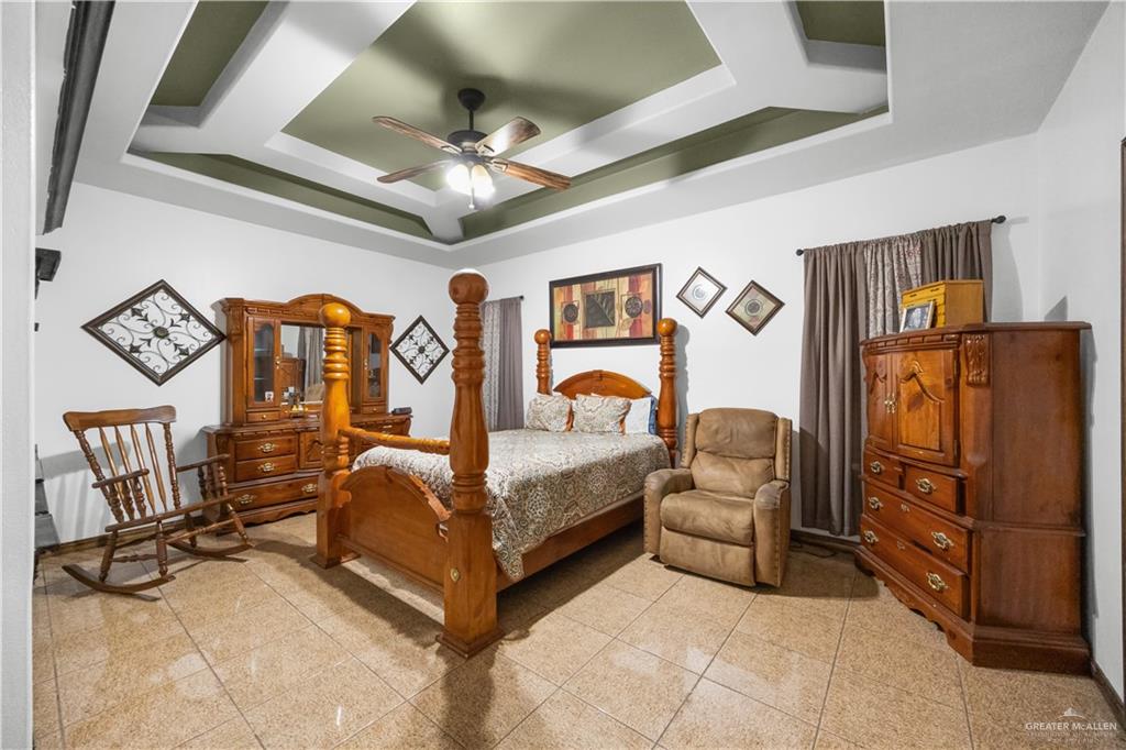 6813 North Gwin Road Edinburg, TX 78542 - Photo 12 of 20 a bedroom with furniture and wooden floor