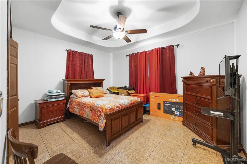 6813 North Gwin Road Edinburg, TX 78542 - Photo 15 of 20 a bedroom with a bed and dresser