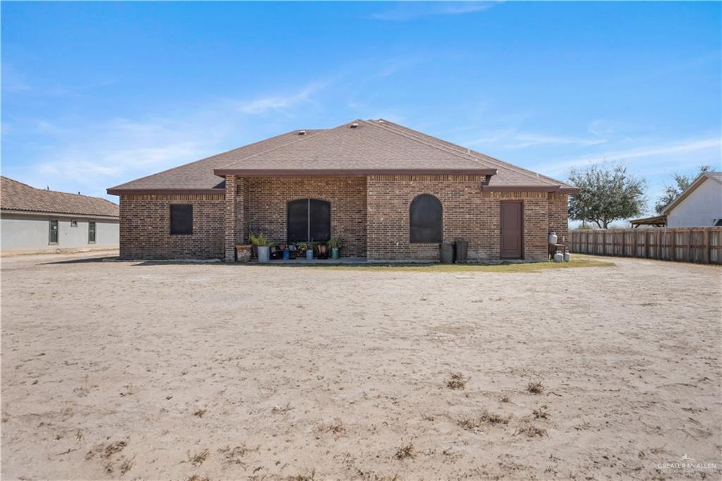 6813 North Gwin Road Edinburg, TX 78542 - Photo 18 of 20 a view of house with yard