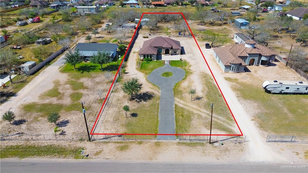 6813 North Gwin Road Edinburg, TX 78542 - Photo 3 of 20 an aerial view of a house with a swimming pool