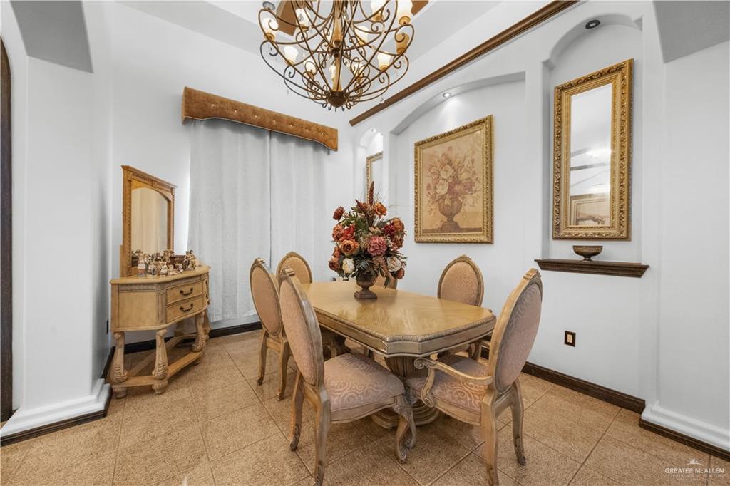 6813 North Gwin Road Edinburg, TX 78542 - Photo 6 of 20 a dining room with furniture and window