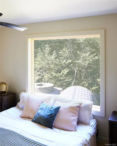 a en suite bathroom with a double vanity sink a mirror and a bathtub