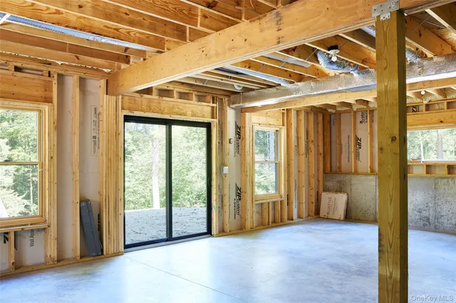 a view of a wooden door and a yard