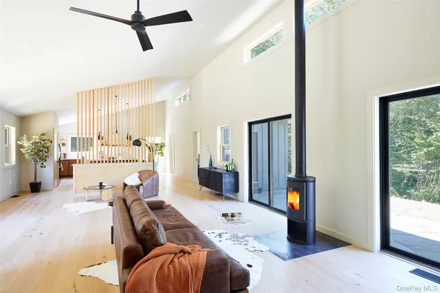 a living room with furniture window and wooden floor