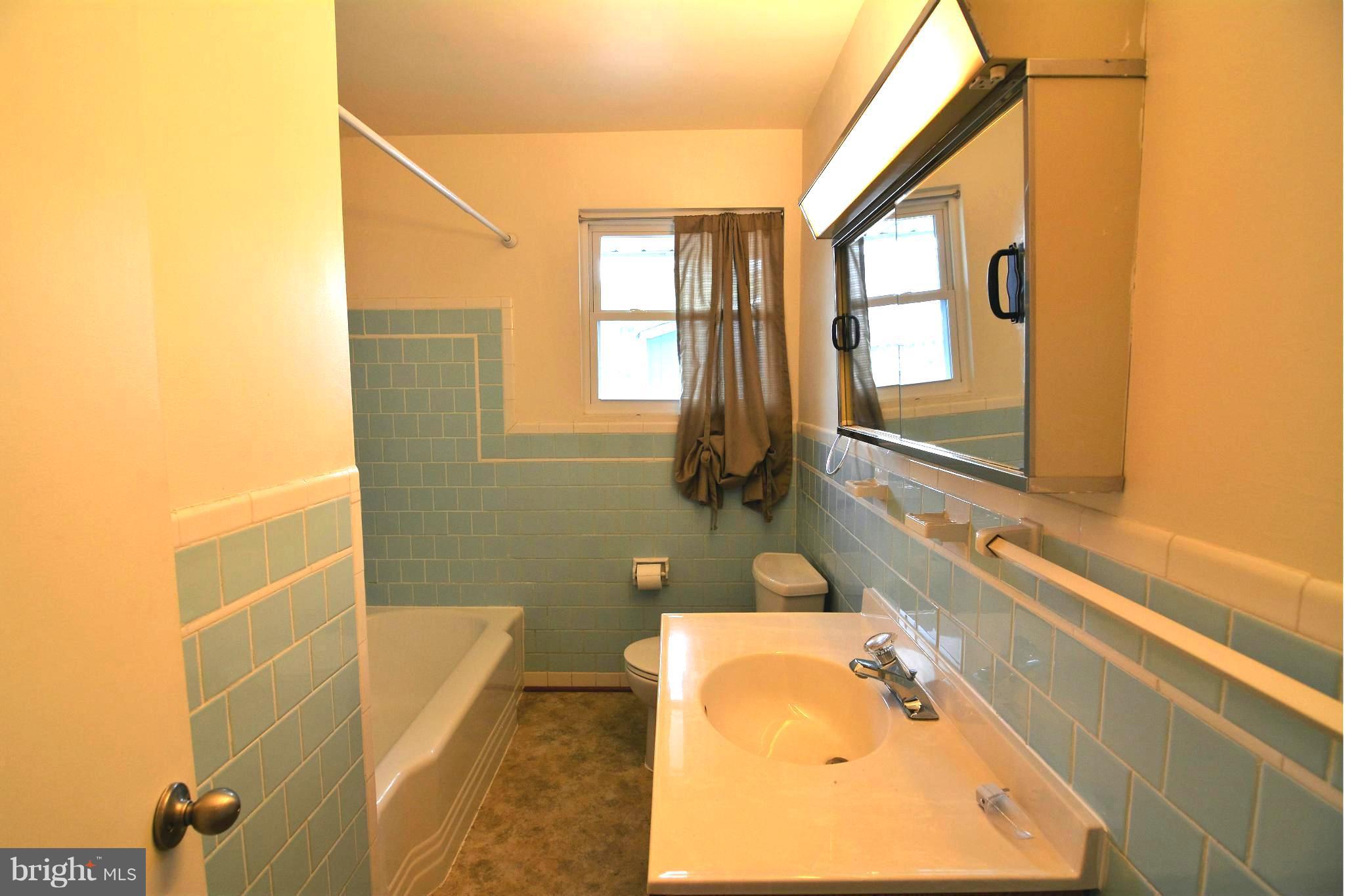 126 Carroll Road Pasadena, MD 21122 - Photo 12 of 28 Retro-Tiled Shared Bedroom Full Bath