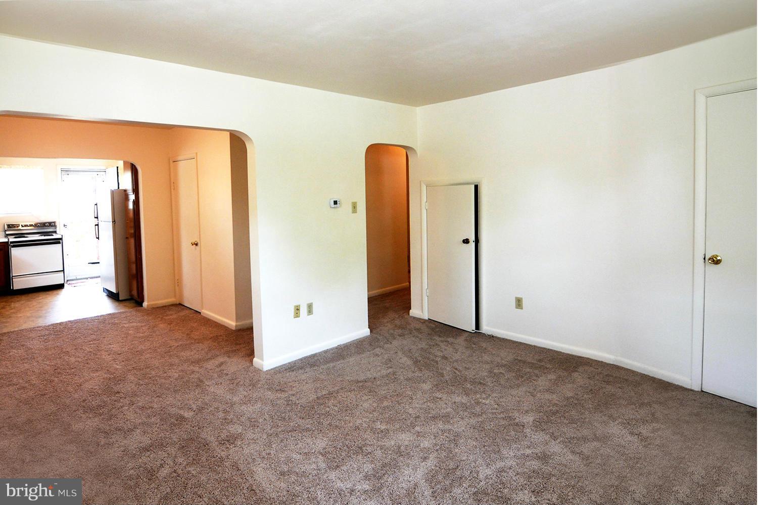 126 Carroll Road Pasadena, MD 21122 - Photo 13 of 28 Main Level Living Room / Graceful Arched Doorways