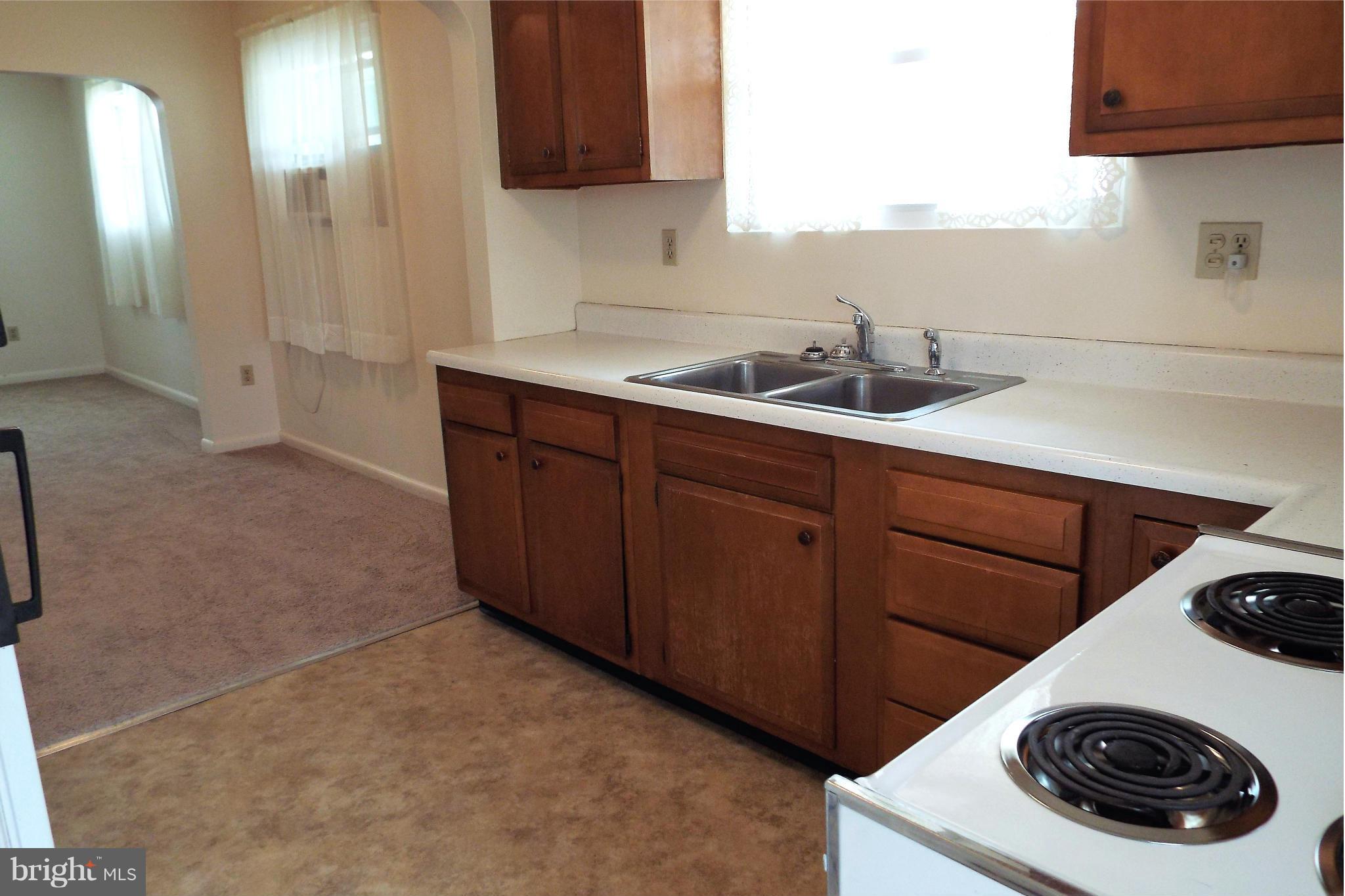 126 Carroll Road Pasadena, MD 21122 - Photo 15 of 28 Crisp White Kitchen Appliances / Wood Cabinetry