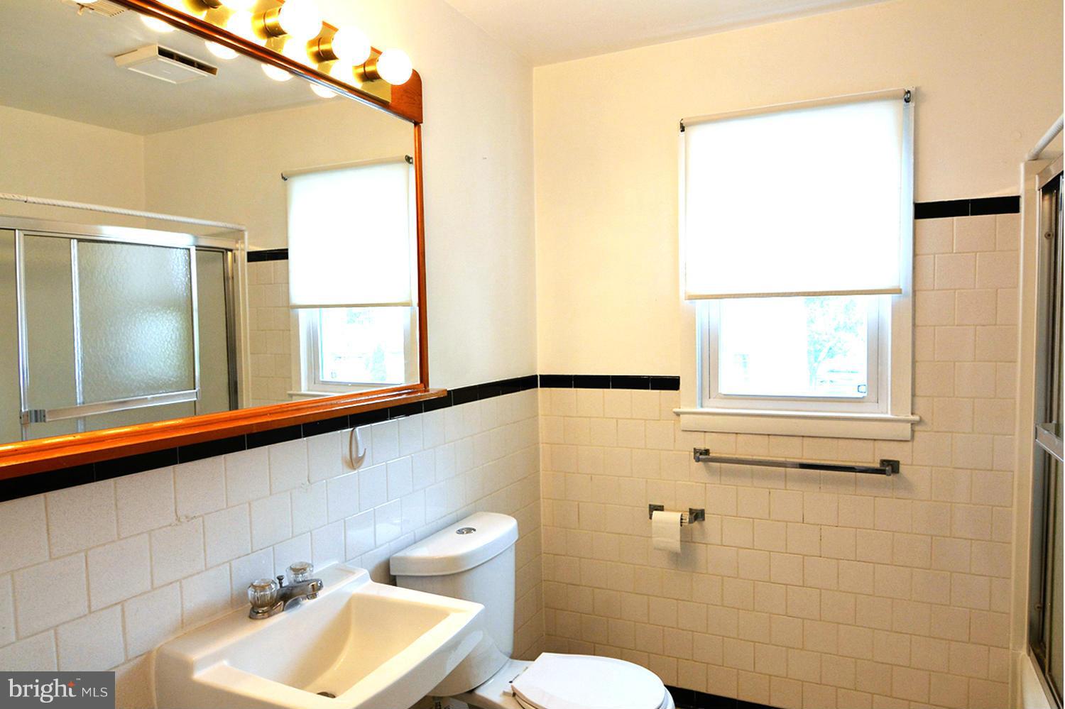 126 Carroll Road Pasadena, MD 21122 - Photo 18 of 28 Attractively Appointed Shared Bedroom Tile Bath