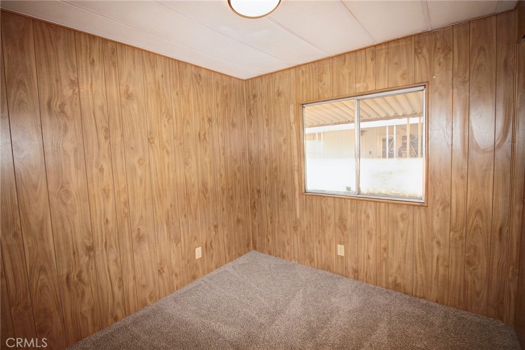 1155 Pease Road, Unit 24 Yuba City, CA 95991 - Photo 13 of 30 a view of an empty room with a window