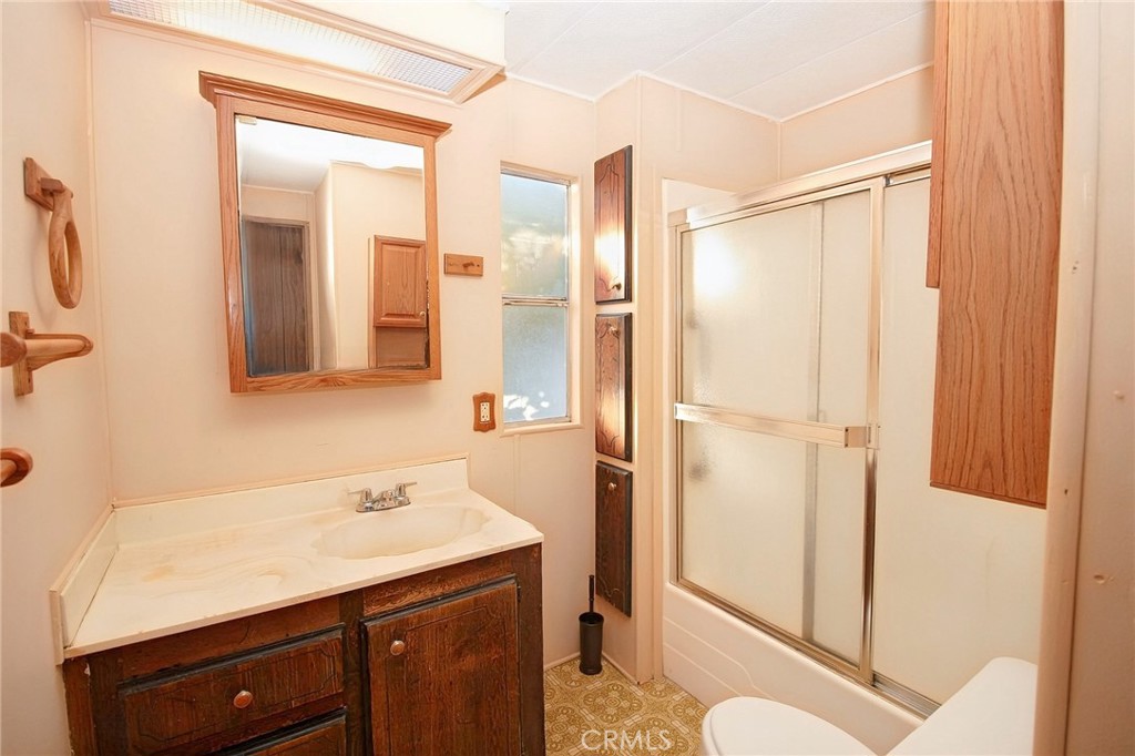 1155 Pease Road, Unit 24 Yuba City, CA 95991 - Photo 15 of 30 a bathroom with a shower sink and mirror