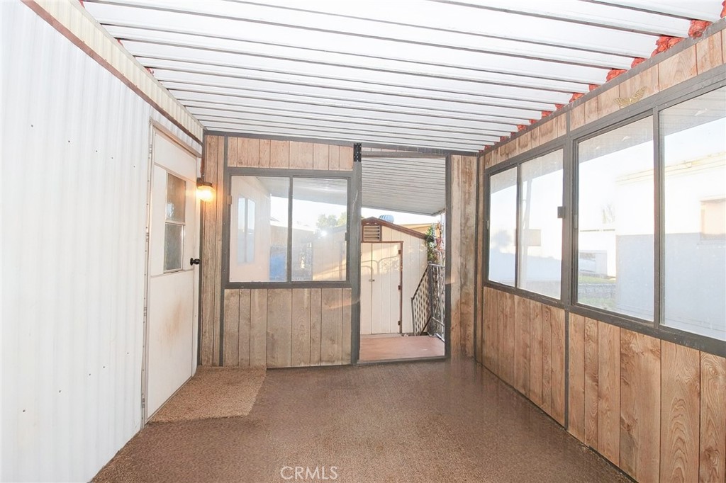1155 Pease Road, Unit 24 Yuba City, CA 95991 - Photo 21 of 30 a view of a hallway with wooden floor and staircase