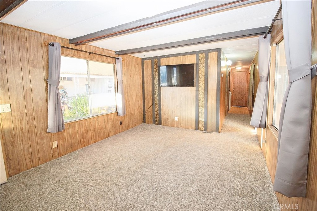 1155 Pease Road, Unit 24 Yuba City, CA 95991 - Photo 5 of 30 a view of empty room with wooden floor and fan