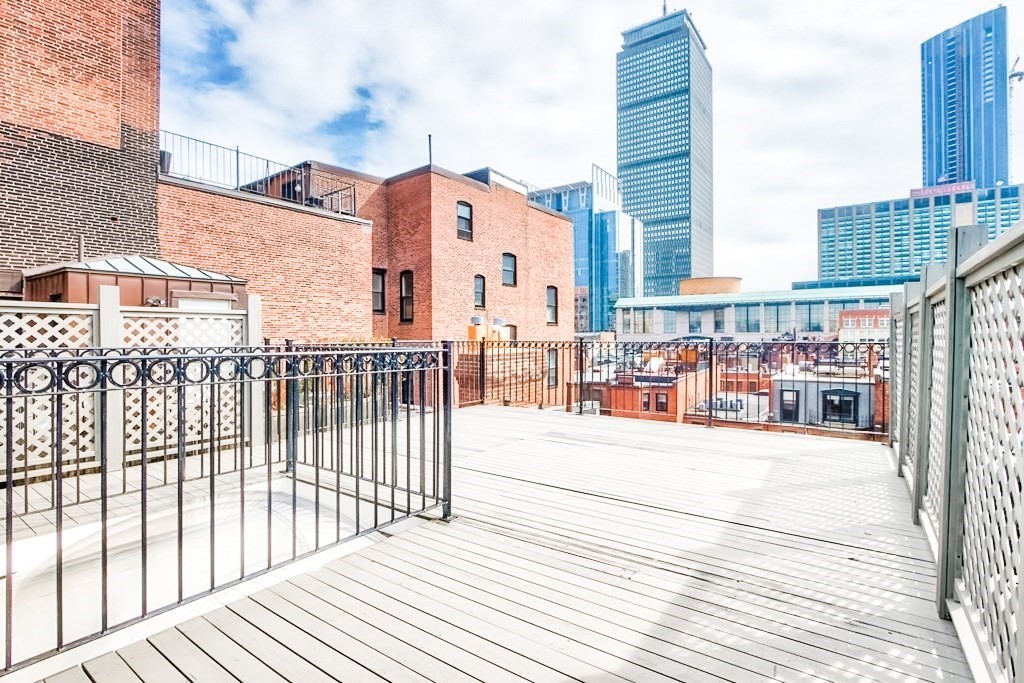 a view of a balcony with city view