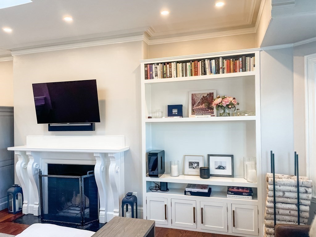 296 Commonwealth Avenue, Unit 5 Boston, MA 02115 - Photo 11 of 29 a living room with furniture fireplace and flat screen tv