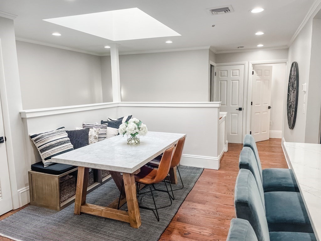 296 Commonwealth Avenue, Unit 5 Boston, MA 02115 - Photo 13 of 29 a view of a dining room with furniture and wooden floor