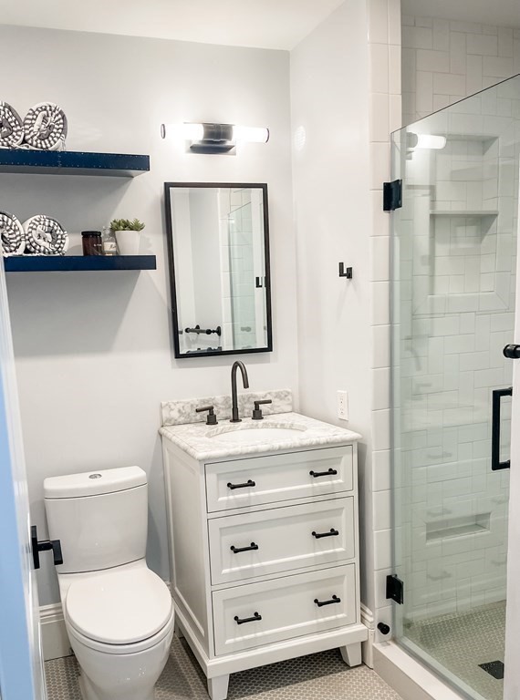 296 Commonwealth Avenue, Unit 5 Boston, MA 02115 - Photo 22 of 29 a bathroom with a toilet a sink and mirror