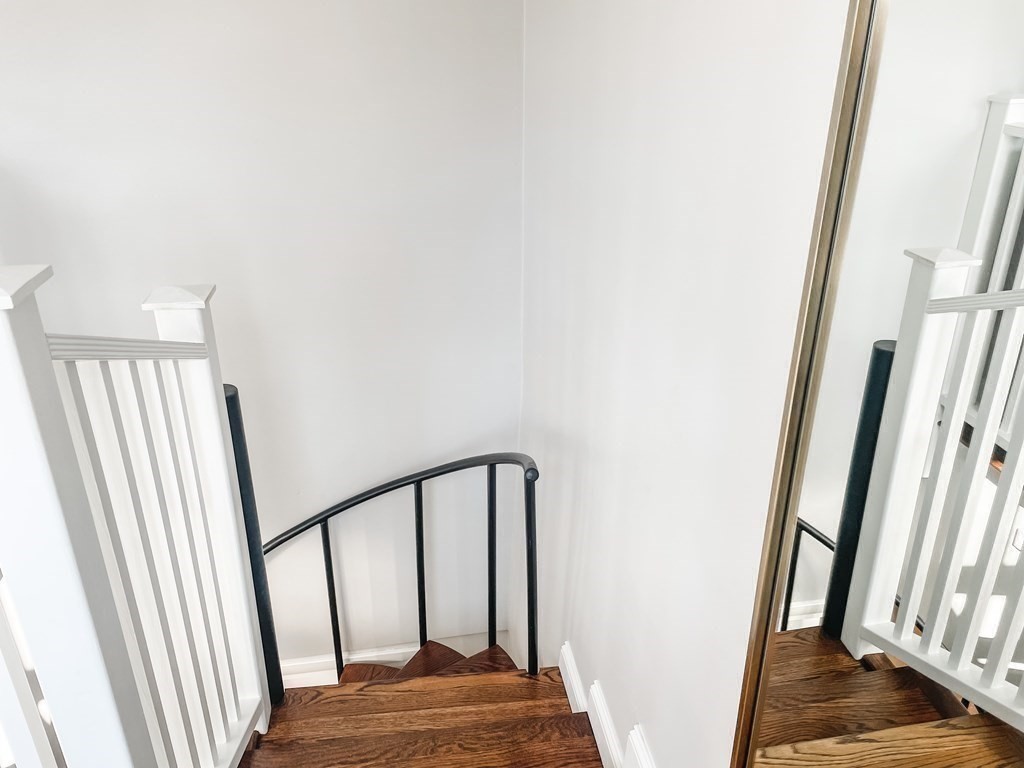 296 Commonwealth Avenue, Unit 5 Boston, MA 02115 - Photo 8 of 29 a view of staircase with white walls and a window
