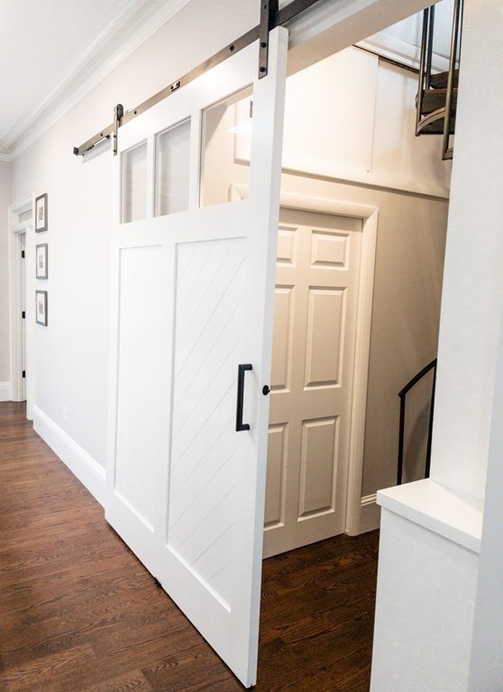 296 Commonwealth Avenue, Unit 5 Boston, MA 02115 - Photo 9 of 29 a view of a hallway with wooden floor