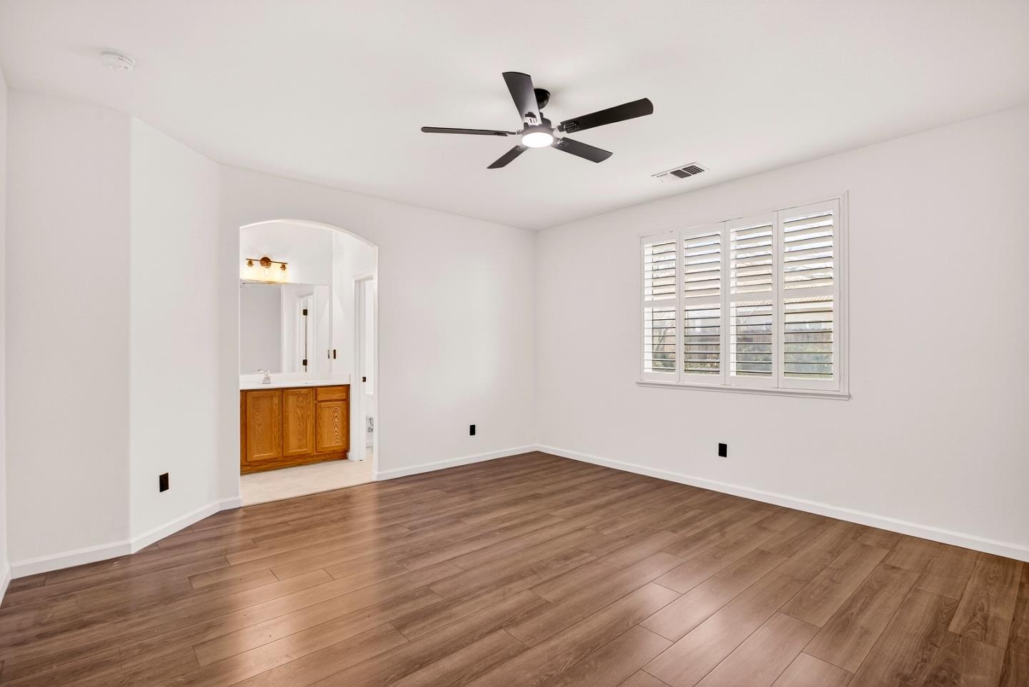 1825 Vermont Street Gridley, CA 95948 - Photo 23 of 57 a view of an empty room with wooden floor and a window