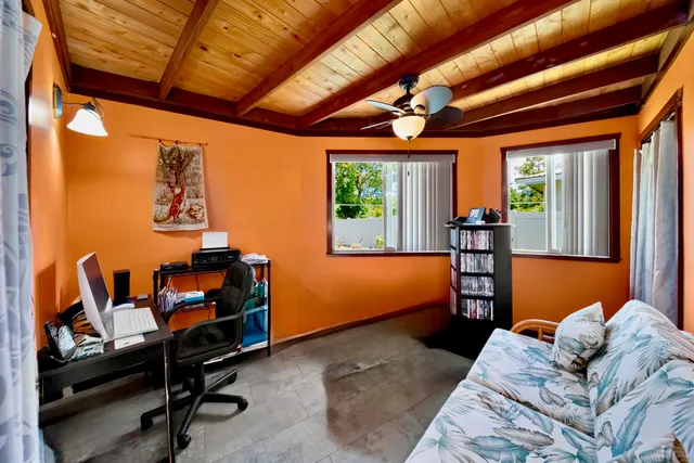 a bedroom with furniture and a window