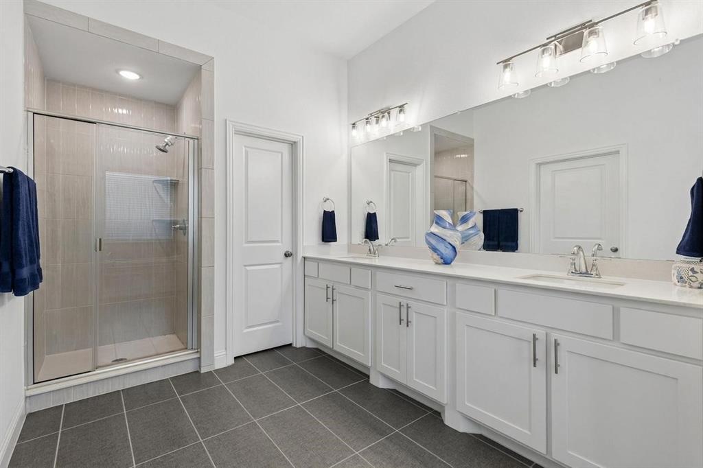 4933 Switchback Street Little Elm, TX 76227 - Photo 12 of 33 Large dual vanity for plenty of personal space for both, plus an oversized shower!